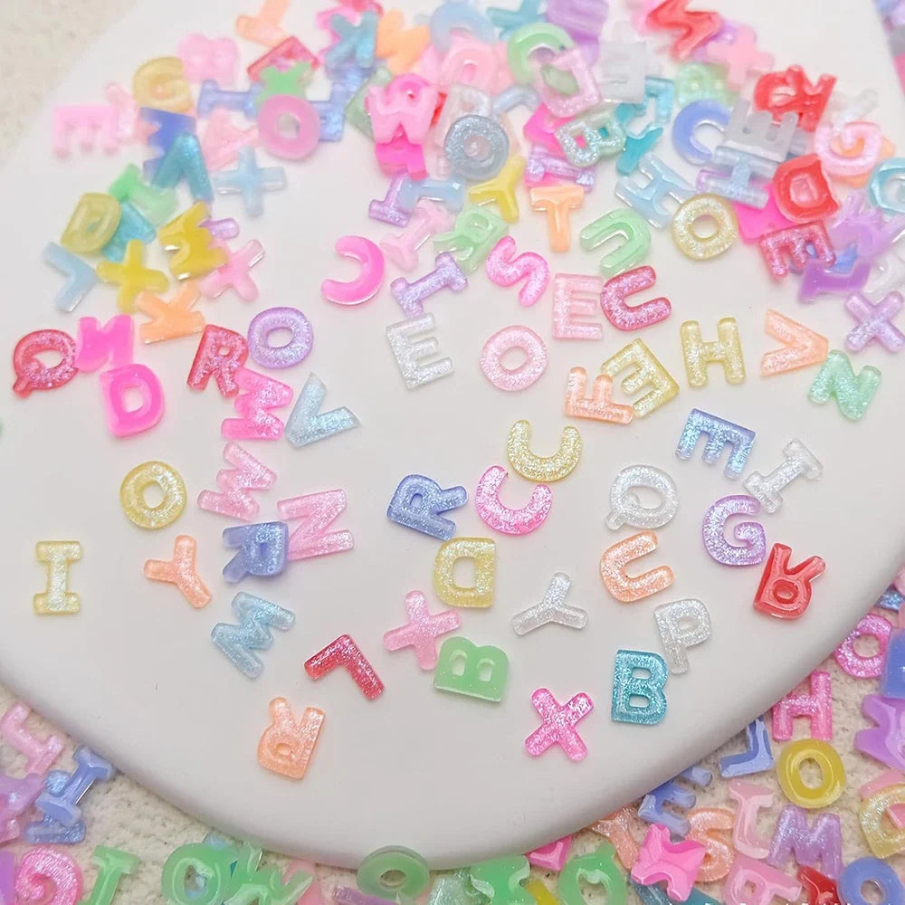 100pcs Mix Letter Nail Art Charms Candy Color with Glitter Resin Nail Rhinestones Kawaii Flatback Alphabet DIY Craft Supplies